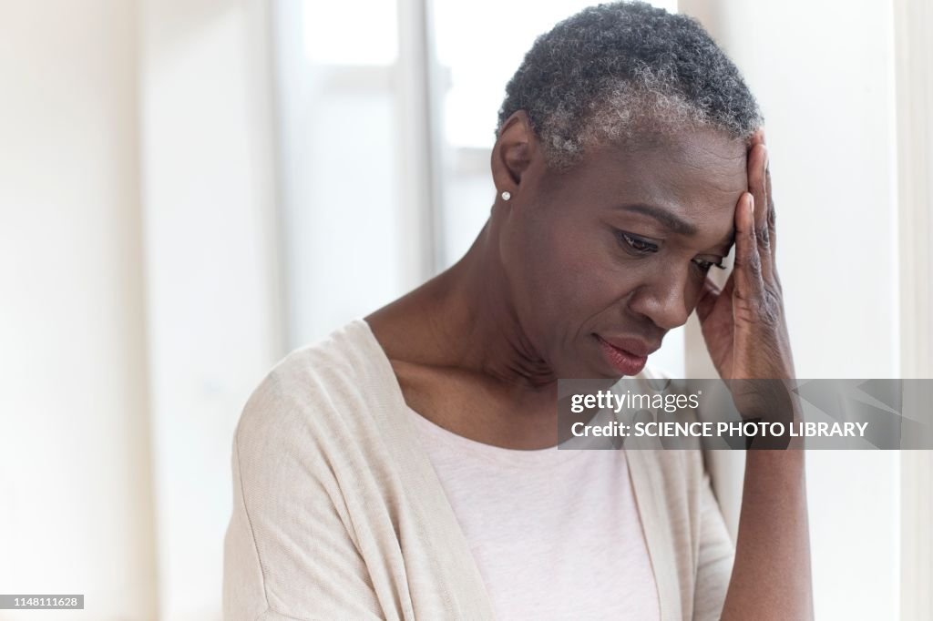 Woman touching head