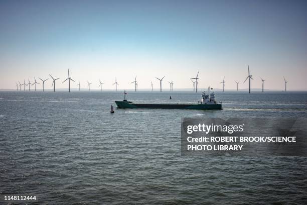 ship passing wind turbines - air freight transportation stock pictures, royalty-free photos & images