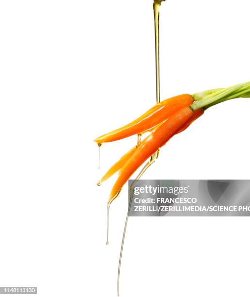 oil drizzling on carrots - olive oil splash stock pictures, royalty-free photos & images