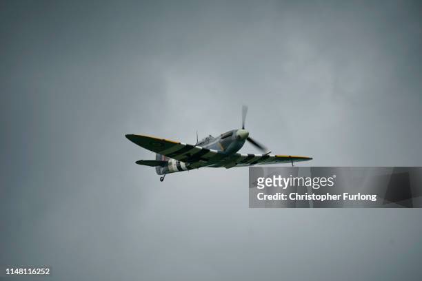 Plane flies over prior to paratroopers taking part in a parachute drop onto fields at Sannerville on June 05, 2019 at Sannerville, France. Veterans,...