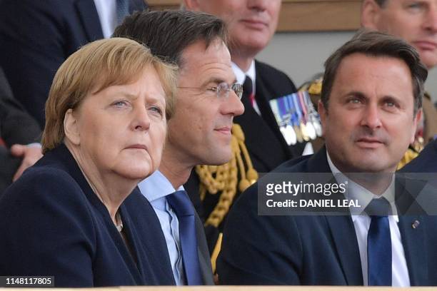 German Chancellor Angela Merkel , Dutch Prime Minister Mark Rutte and Luxembourg's Prime Minister Xavier Bettel attend an event to commemorate the...