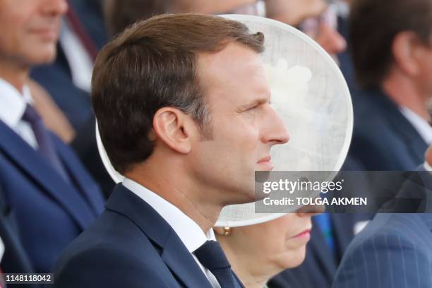 French President Emmanuel Macron and Britain's Prime Minister Theresa May attend an event to commemorate the 75th anniversary of the D-Day landings,...