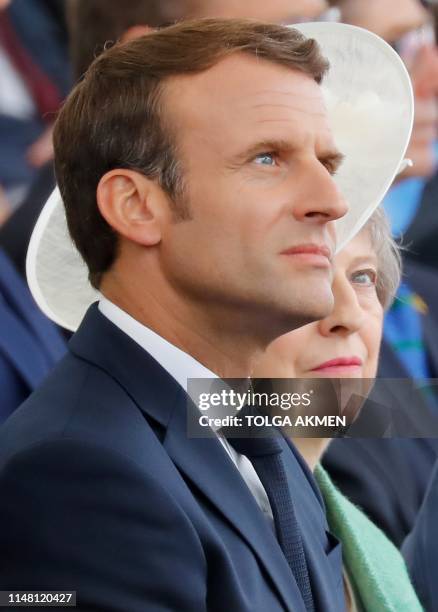 French President Emmanuel Macron and Britain's Prime Minister Theresa May attend an event to commemorate the 75th anniversary of the D-Day landings,...