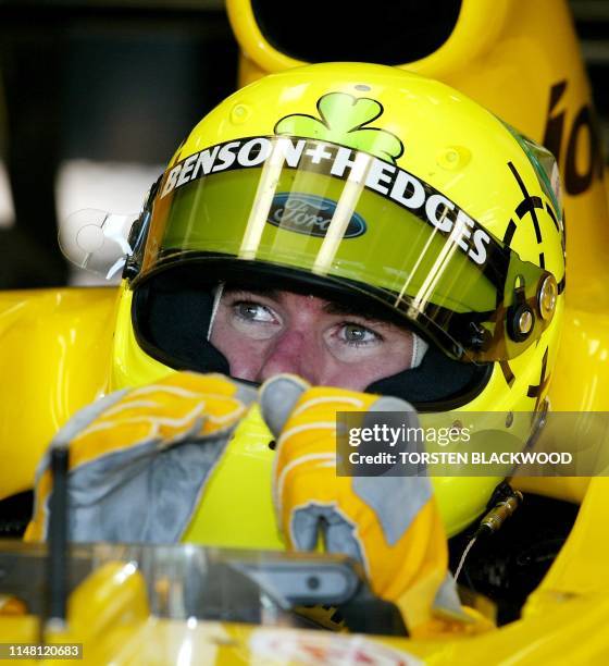 British/Irish rookie Ralph Firman gestures to his pit crew during the first practice session of the Australian Formula One Grand Prix in Melbourne,...