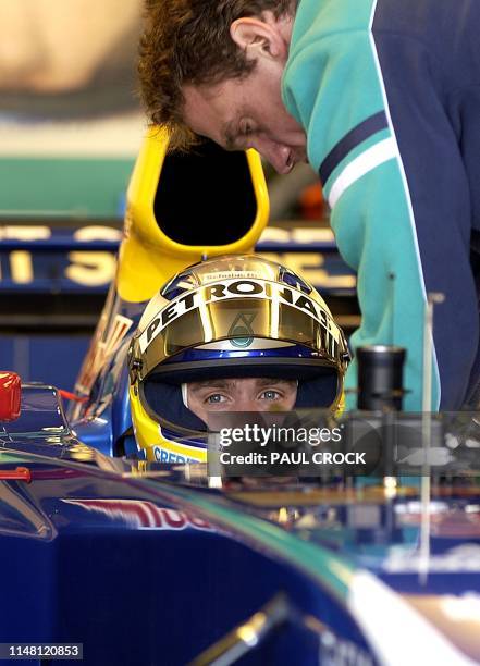 Nick Heidfeld of Germany prepares his Sauber race car on the eve of the first practice for the Australian Formula One Grand Prix in Melbourne, 06...