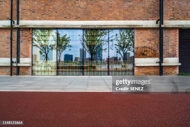 upscale shops on pedestrian street - empty store window stock-fotos und bilder