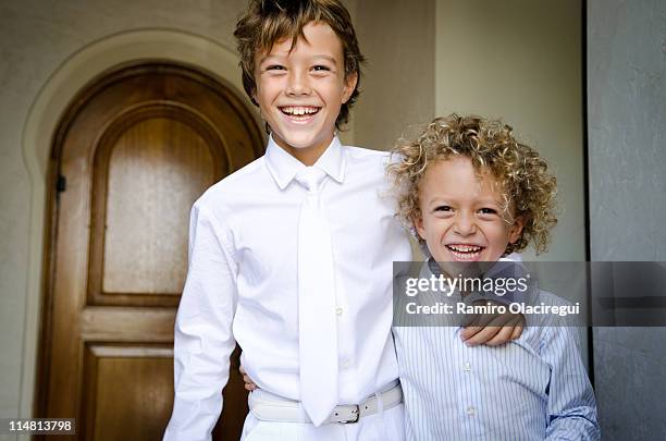 brothers smiling first communion - communion stock pictures, royalty-free photos & images