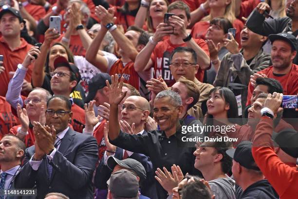 The 44th President of the United States, Barack Obama waves to the crowd during Game Two of the NBA Finals between the Golden State Warriors and the...