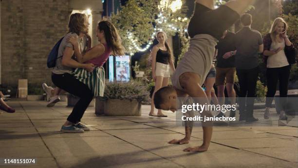 summer night in the city. crowd cheering and dancing - street party stock pictures, royalty-free photos & images