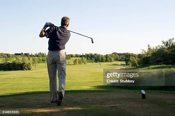 golfer - golf swing from behind stock pictures, royalty-free photos & images