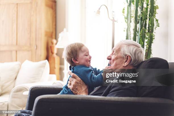 multi-generation family spending time together for father's day - grandfather stock pictures, royalty-free photos & images