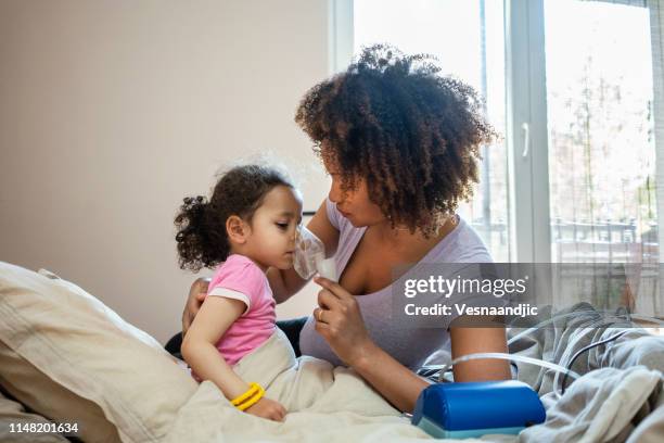 mother taking care on her sick daughter - food allergy stock pictures, royalty-free photos & images