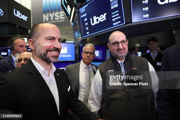 Uber CEO Dara Khosrowshahi walks the floor of the New York Stock Exchange after the Opening Bell at the NYSE as the ride-hailing company Uber makes...