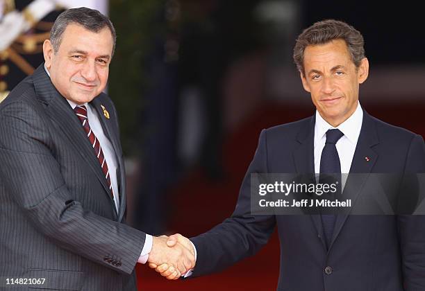 French President Nicolas Sarkozy welcomes Egyptian Prime Minister, Essam Sharaf to day two of the G8 Summit on May 27, 2011 in Deauville, France. The...