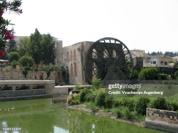 norias of hama, water wheels, syria - hama stock pictures, royalty-free photos & images