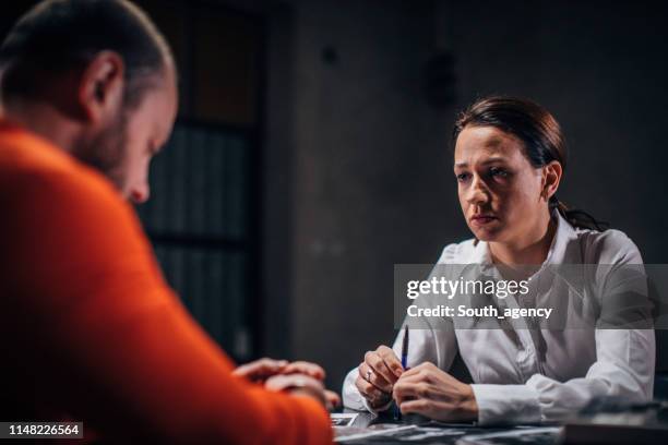 prisoner and female detective - confession law stock pictures, royalty-free photos & images