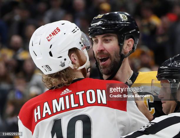 Zdeno Chara of the Boston Bruins and Dougie Hamilton of the Carolina Hurricanes have words in Game One of the Eastern Conference Final during the...