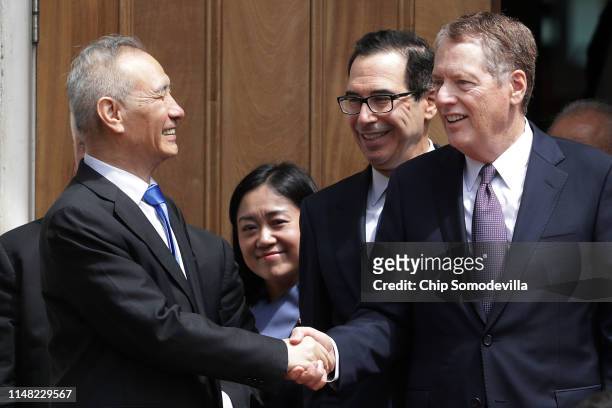 Chinese Vice Premier Liu He says goodby to U.S. Treasury Secretary Steven Mnuchin and U.S. Trade Representative Robert Lighthizer as they break from...