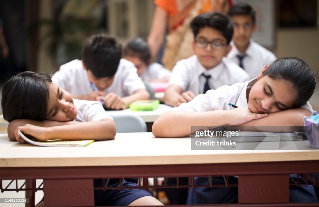 How To Sleep In Class Students Sleeping In Classroom High-Res Stock Photo - Getty Images