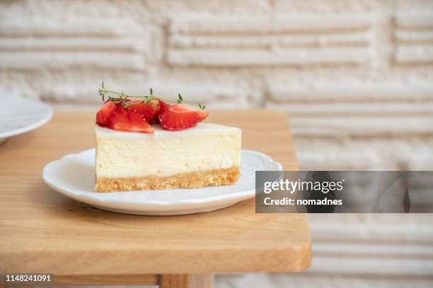 strawberry cheesecake on a white plate. - cheesecake stock pictures, royalty-free photos & images