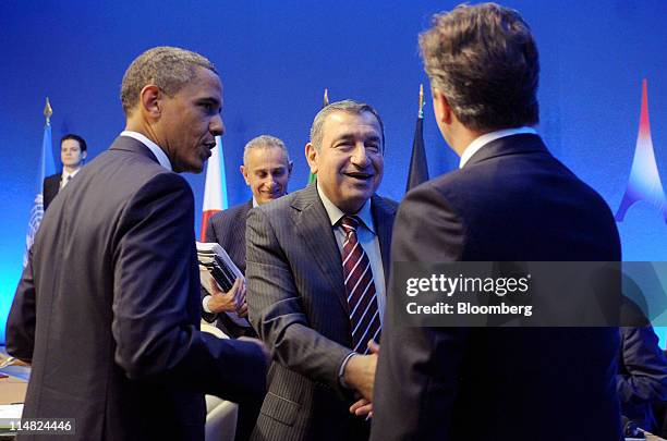 President Barack Obama, left, speaks as Essam Sharaf, Egypt's prime minister, second right, shakes hands with David Cameron, U.K. Prime minister,...