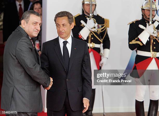 French President Nicolas Sarkozy welcomes Egyptian Prime Minister, Essam Sharaf to day two of the G8 Summit on May 27, 2011 in Deauville, France. The...