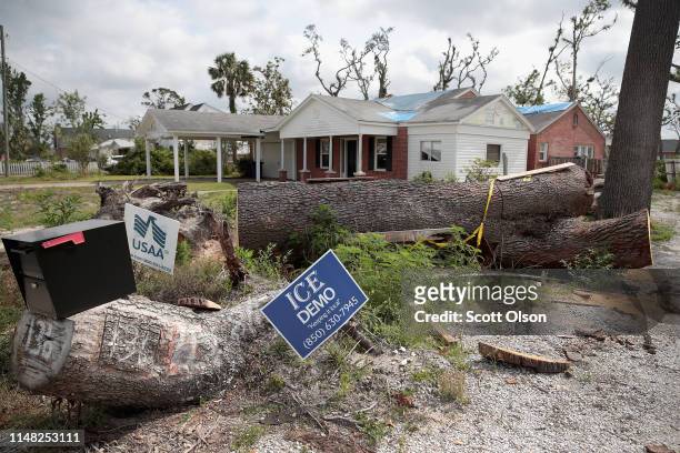 Tarps remain on the roof of a home damaged by Hurricane Michael on May 10, 2019 in Panama City, Florida. Seven months after the category five...