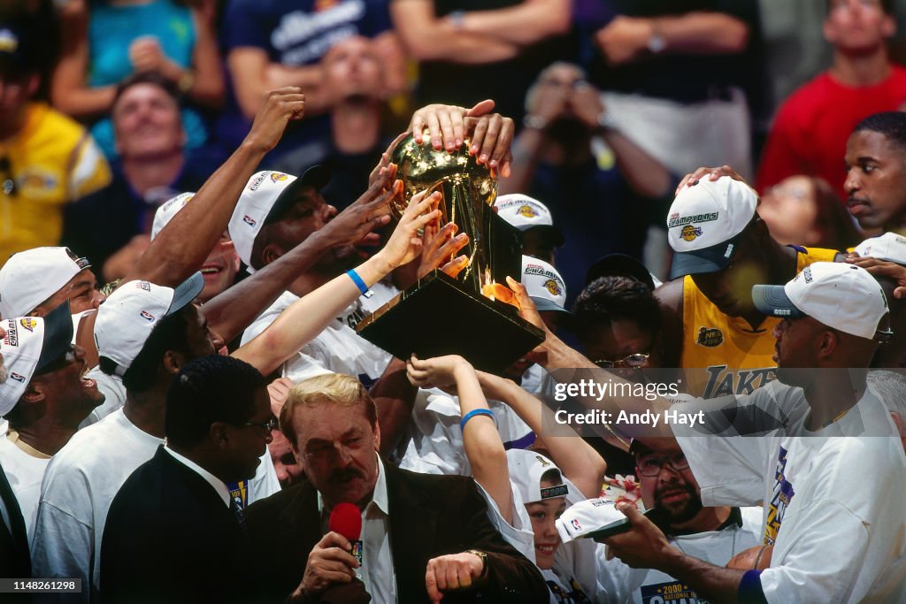 The Los Angeles Lakers Hold Up The Larry O Brien Championship Trophy the-los-angeles-lakers-hold-up-the-larry-o-brien-championship-trophy