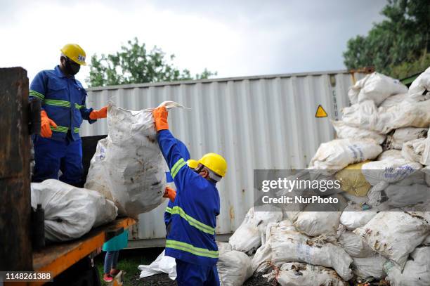 Workers from the recycle company Blue Waste 2 Value load the waste garbage's collected from Mount Everest and Base Camp in Kathmandu, Nepal on...