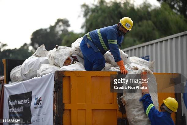 Workers from the recycle company Blue Waste 2 Value load the waste garbage's collected from Mount Everest and Base Camp in Kathmandu, Nepal on...