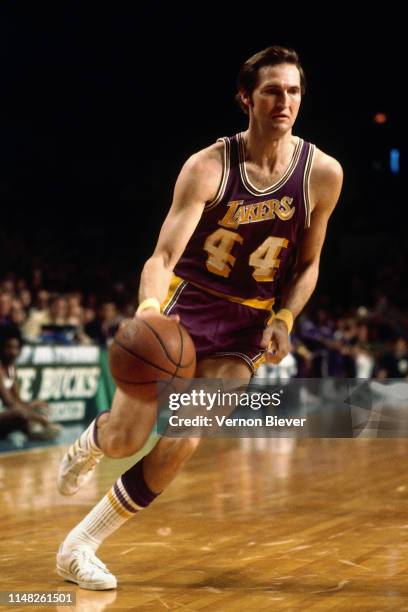 Jerry West of the Los Angeles Lakers handles the ball against the Milwaukee Bucks on November 26, 1974 at the Milwaukee Arena in Milwaukee,...