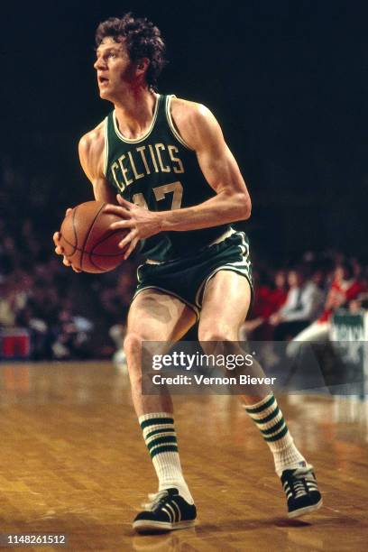 John Havlicek of the Boston Celtics handles the ball against the Milwaukee Bucks on February 6, 1974 at the Milwaukee Arena in Milwaukee, Wisconsin....