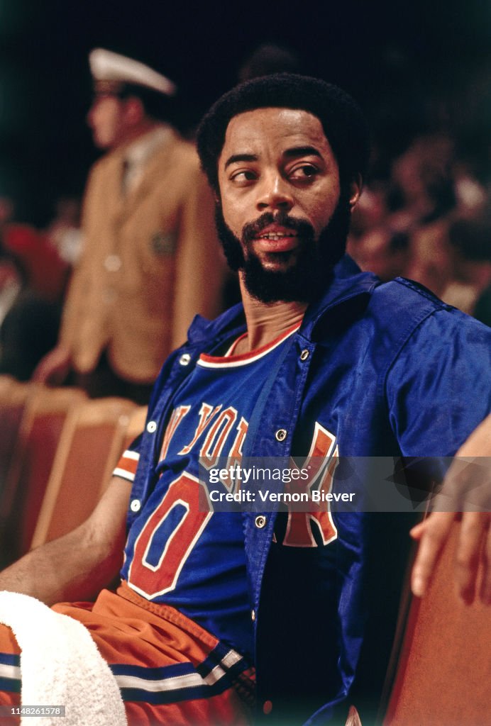 Walt Frazier of the New York Knicks looks on during the game against ...