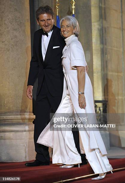 Christine Lagarde, French Finance Minister arrives with her companion French businessman Xavier Giocanti at the Elysee presidential palace in Paris...