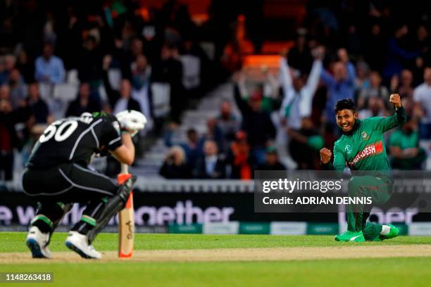 Bangladesh's Mosaddek Hossain celebrates after taking the wicket of New Zealand's James Neesham during the 2019 Cricket World Cup group stage match...