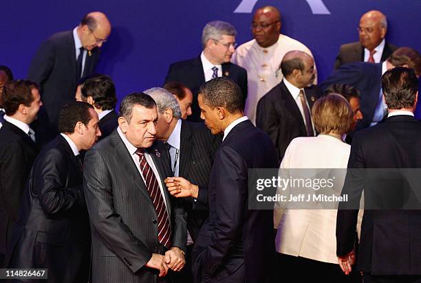 Prsident Barack Obama talks with Egyptian Prime Minister, Essam Sharaf as leaders pose during the family photo at the G8 Summitt on May 27, 2011 in...