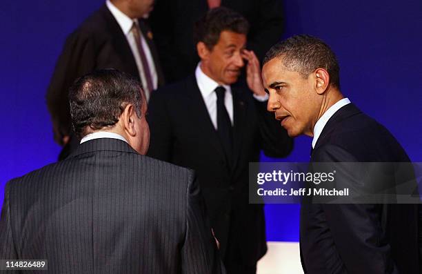 Prsident Barack Obama talks with Egyptian Prime Minister, Essam Sharaf as leaders pose during the family photo at the G8 Summitt on May 27, 2011 in...