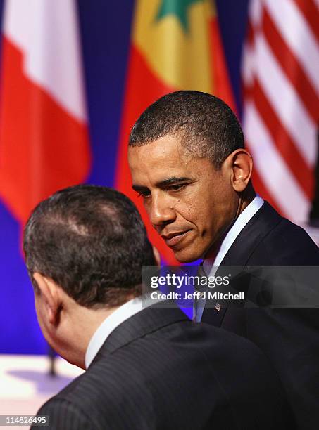 Prsident Barack Obama talks with Egyptian Prime Minister, Essam Sharaf as leaders pose during the family photo at the G8 Summitt on May 27, 2011 in...