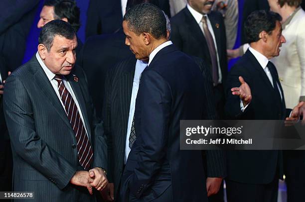 President Barack Obama talks with Egyptian Prime Minister, Essam Sharaf during the family photo at the G8 Summitt on May 27, 2011 in Deauville,...