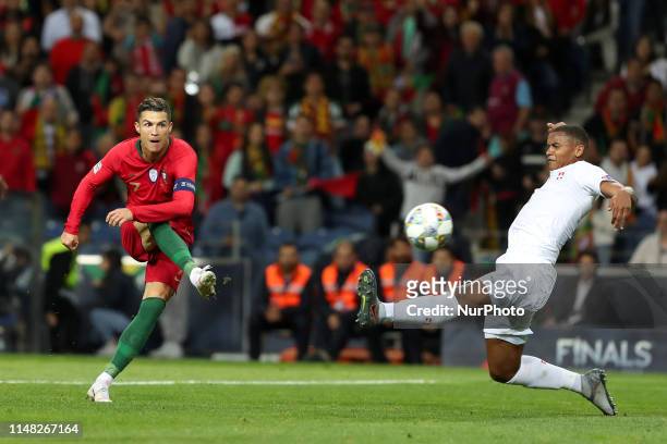 Portugal's forward Cristiano Ronaldo shoots to score during the UEFA Nations League Semi-Final football match Portugal vs Switzerland, at the Dragao...