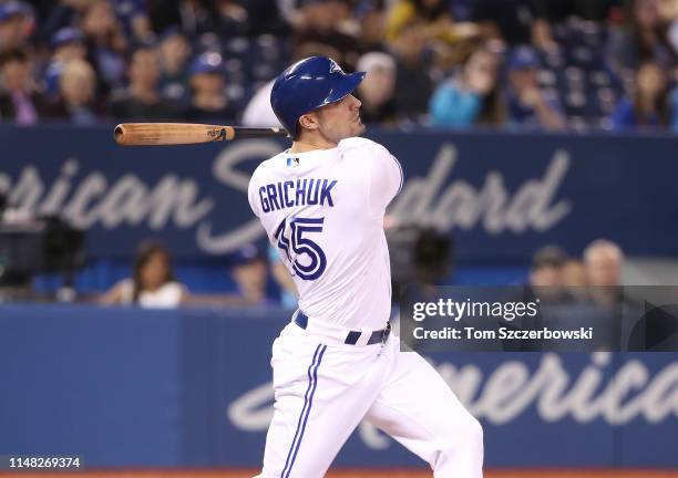 Randal Grichuk of the Toronto Blue Jays hits a two-run home run in the first inning during MLB game action against the New York Yankees at Rogers...