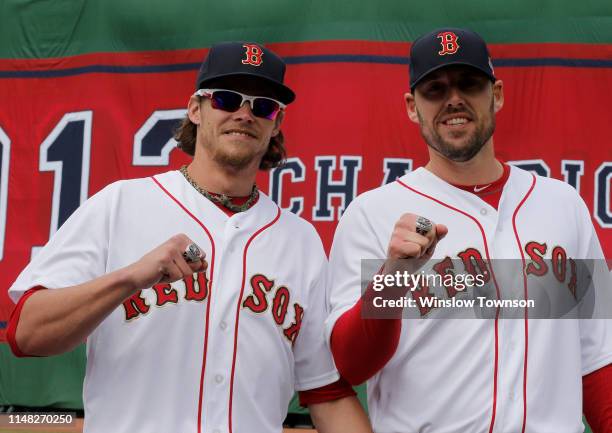 Starting pitchers Clay Buchholz of the Boston Red Sox, left, and John Lackey of the Boston Red Sox show off their 2013 World Series rings before the...