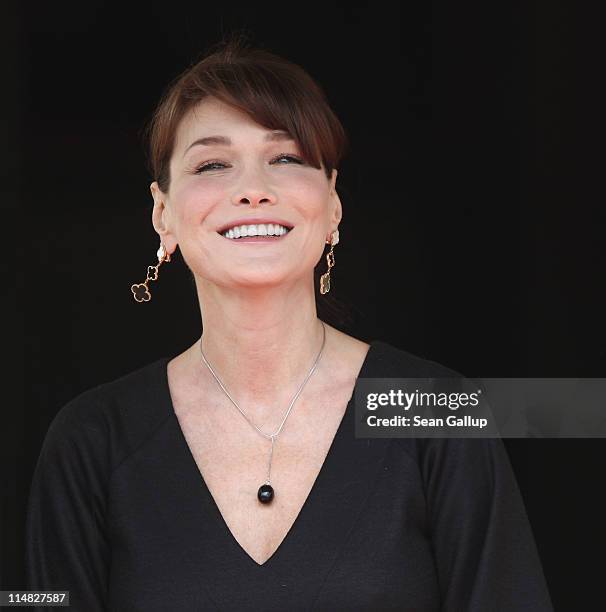 French First Lady Carla Bruni-Sarkozy, who is pregnant, stands outside Le Ciro's Resaturant before lunch with the spouses of heads of state on the...