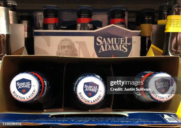 Bottles of Samuel Adams beer are displayed on a shelf at grocery store on May 10, 2019 in San Francisco, California. Boston Beer Company, the second...