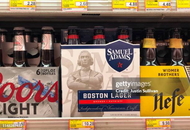 Bottles of Samuel Adams beer are displayed on a shelf at grocery store on May 10, 2019 in San Francisco, California. Boston Beer Company, the second...