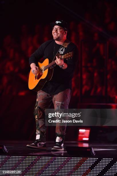 Recording Artist Mitchell Tenpenny performs on stage during the 2019 CMT Music Awards Show at Bridgestone Arena on June 5, 2019 in Nashville,...