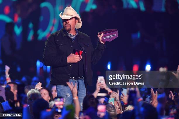 Toby Keith speaks on stage during 2019 CMT Music Awards Show at Bridgestone Arena on June 5, 2019 in Nashville, Tennessee.