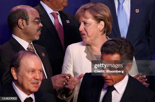 Meles Zenawi, Ethiopia's Prime Minister, top left, speaks with Angela Merkel, Germany's chancellor, second right, prior to the family photograph at...