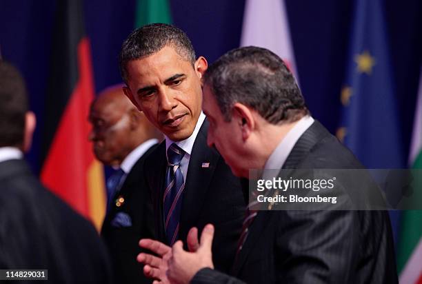 President Barack Obama, center left, listens to Essam Sharaf, Egypt's prime minister, right, prior to the family photograph during the G8 summit in...