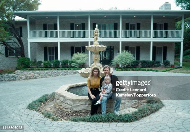 American golfer Ben Crenshaw with his wife Julie and daughter Katherine in front of their home in Austin, Texas, circa 1989.